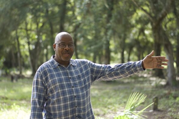 Willy Cooper, president of the WAIA showing the cemetery. 