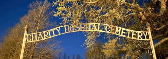Photo by Samara Storvick
"Charity Hospital Sign at Night"